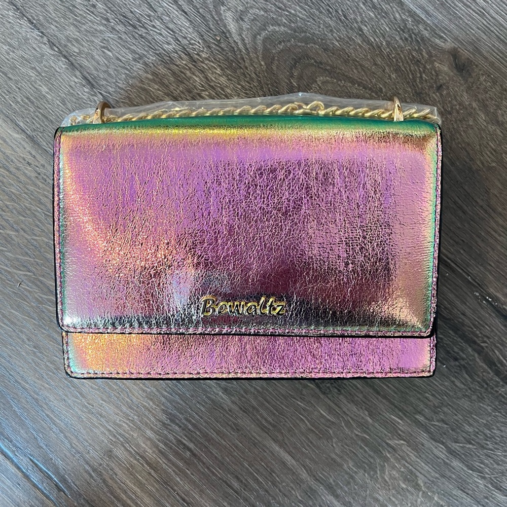 Pink holographic crossbody bag.